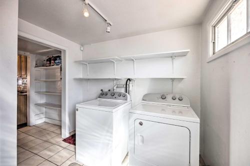 a white laundry room with a washer and dryer at Cozy Colorado Springs Home Near Garden of the Gods in Colorado Springs