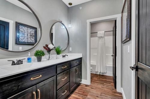 a bathroom with a sink and a mirror at Give Us This Day Chalet in Hollister