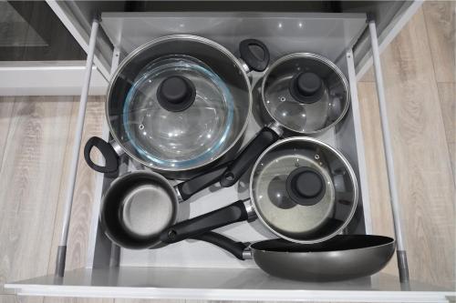 a bunch of pots and pans on a shelf at Redwood in Longton