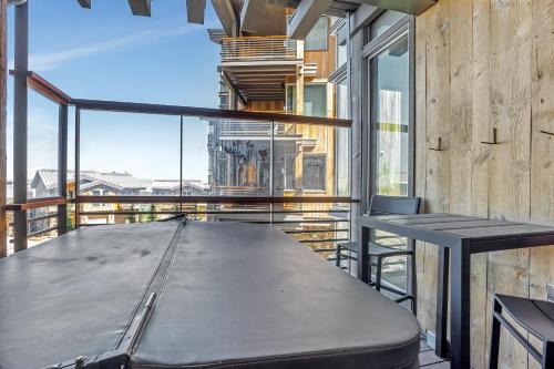 a large table on the balcony of a building at Stein Eriksen Residences in Park City