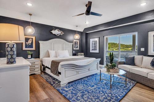 a bedroom with a white bed and a couch at Absolutely Shore in Hollister