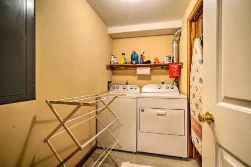 a small kitchen with a white washer and dryer at Idyllic Mount Snow Condo with View and Amenities! in West Dover