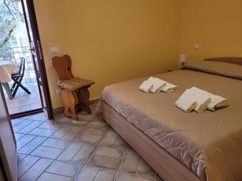 Katil atau katil-katil dalam bilik di Alloggio turistico Magnifico Alessandro Valle Bernardo 04025 Lenola nei pressi di Fondi LT