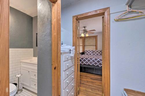 a bathroom with a door leading to a bedroom at Charming Gainesville Townhome Less Than 2 Mi to University in Gainesville