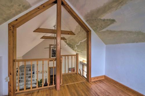 an attic room with a vaulted ceiling at Charming Gainesville Townhome Less Than 2 Mi to University in Gainesville