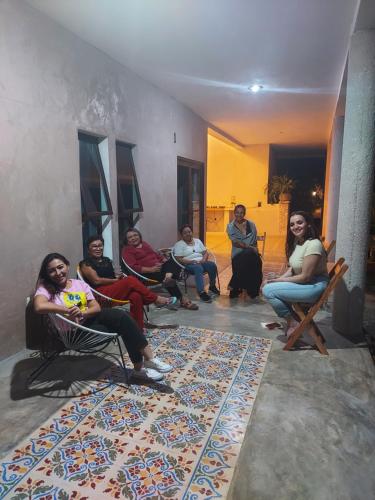 a group of people sitting in chairs in a room at Kuun Beek, hotel y centro holistico in Valladolid