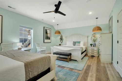 a bedroom with two beds and a table and chairs at A Wave From It All in Hollister