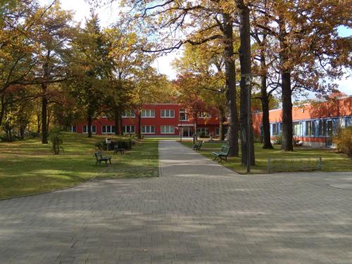 a brick walkway in front of a red building at Gästehaus Pauline in Berlin