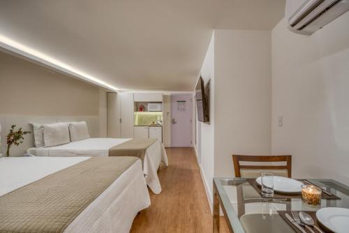 Ένα ή περισσότερα κρεβάτια σε δωμάτιο στο Hotel Brisa Suítes Pajuçara