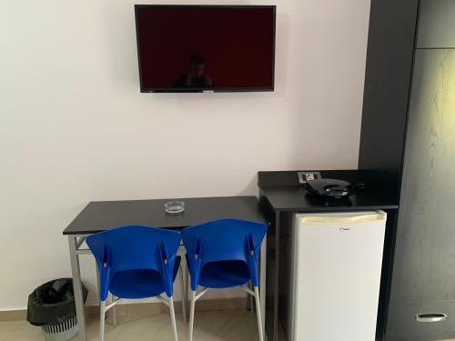 En tv och/eller ett underhållningssystem på Hotel Piazza