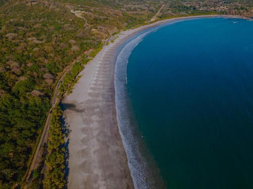 an aerial view of a beach and the ocean at Hotel Giada in Sámara