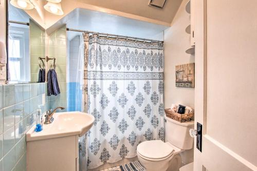 a bathroom with a toilet and a sink and a shower at Central Eugene House with Updated Interior and Yard! in Eugene