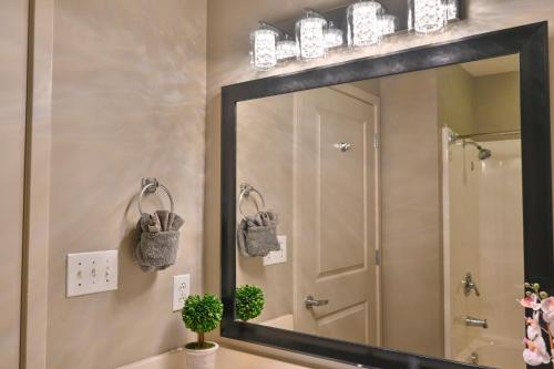 a large mirror in a bathroom with a sink at Huge Ocean Front Condo, Amazing Views in Myrtle Beach