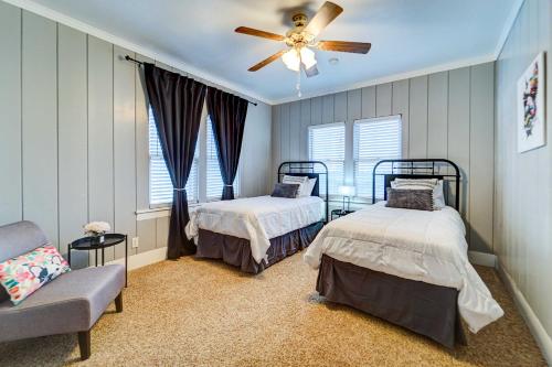 a bedroom with two beds and a ceiling fan at Central Home 1 Mi to Texas Tech and by Dtwn Lubbock in Lubbock