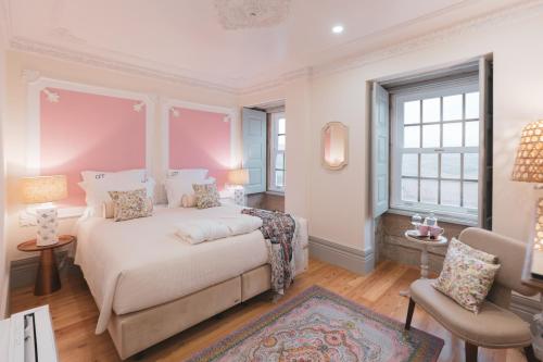 a bedroom with a large bed and a window at Quinta de Travassinhos- Douro Valley & Spa in Santa Marta de Penaguião