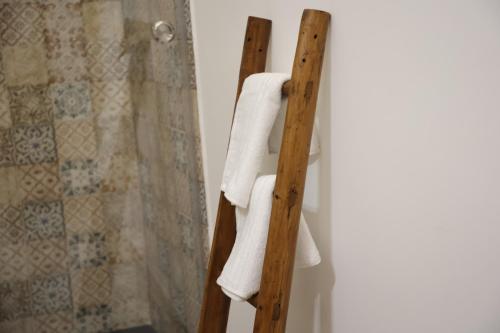 a towel rack in a bathroom with a shower at Antico Monastero in Bitonto