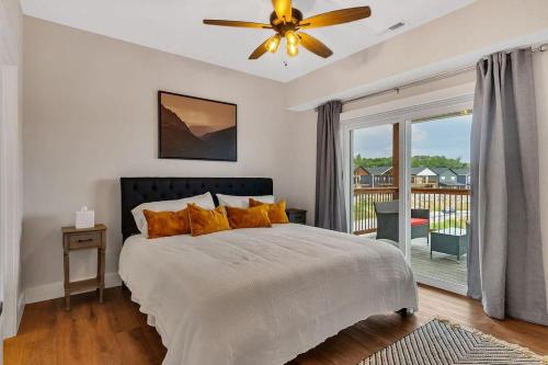 a bedroom with a bed and a ceiling fan at Idle Time at Table Rock Lake in Branson