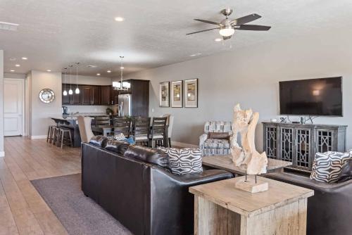 a living room with a couch and a dining room at Adventure Awaits #81 townhouse in Santa Clara