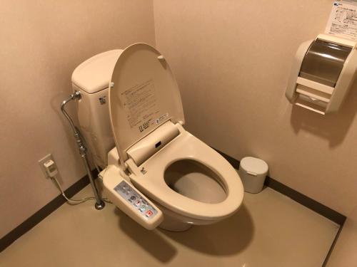 a bathroom with a toilet with an electronic device on it at Aizu Kogen International Human Resources Center - Vacation STAY 67173v in Minamiaizu