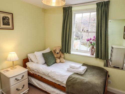 Llit o llits en una habitació de Pavement End Cottage