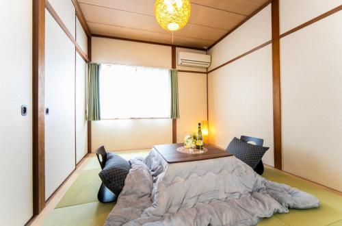 a room with a table and chairs and a window at Takashima - House - Vacation STAY 68992v in Takashima