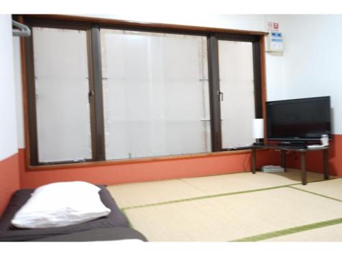 Телевизия и/или развлекателен център в Okinawanoyado Ajimaa - Vacation STAY 71924v