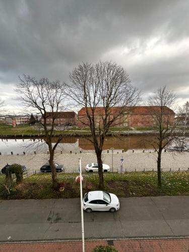 a white car parked on the side of a street at Hafenbrise in Tönning