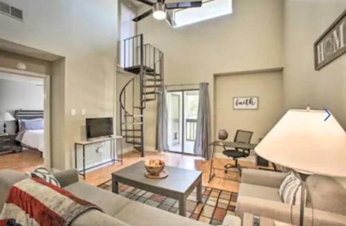 a living room with a couch and a table at New! LSU Baton Rouge Contemporary 3 Bedroom Suite Condo in Baton Rouge