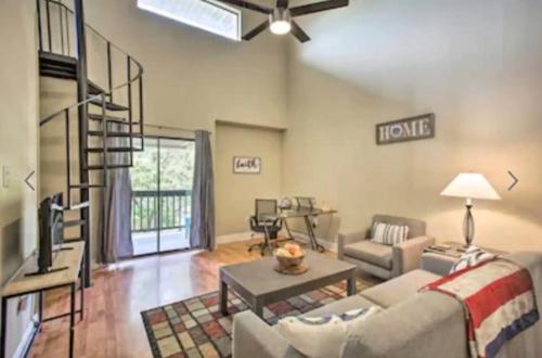 a living room with a couch and a table at New! LSU Baton Rouge Contemporary 3 Bedroom Suite Condo in Baton Rouge