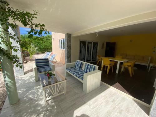 a patio with a couch and chairs and a table at Don Genaro Apartments in Barber