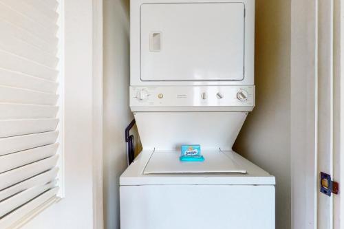 a white washer and dryer in a room at Sandestin Baytowne Wharf - Observation Point South #471 in Destin