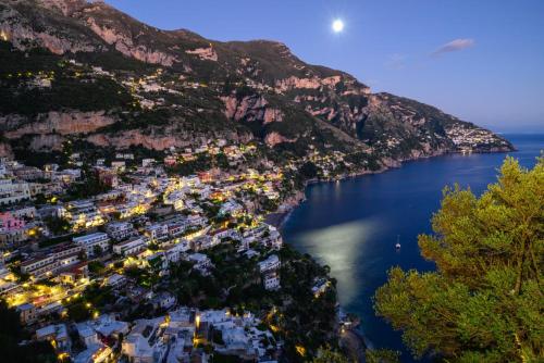 an aerial view of the amalfi coast at night at Lecoccole in Massa Lubrense