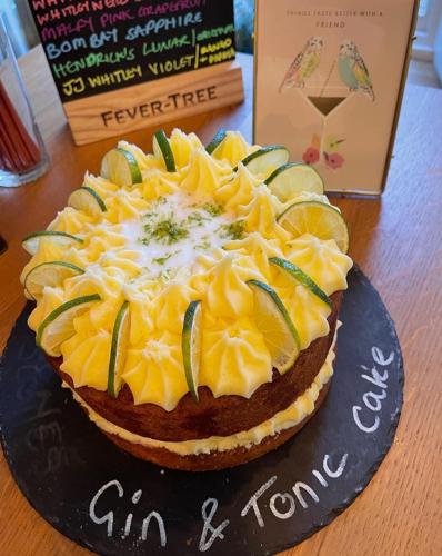 a cake sitting on a plate on a table at Oakhill Hotel in Matlock