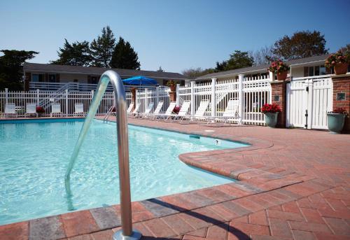a swimming pool with a water slide at Breezeway Boutique Hotel in Westerly
