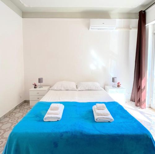 A bed or beds in a room at Odi et Amo - Lido San Giovanni