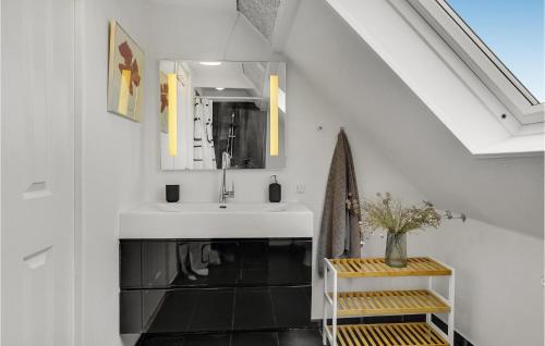 a bathroom with a sink and a mirror at 3 Bedroom Beautiful Home In Bryrup in Bryrup