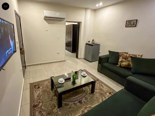 a living room with a couch and a table at Giza Pyramids View Inn in Cairo