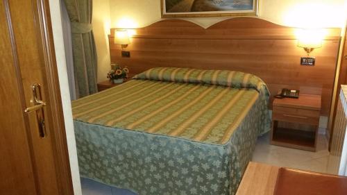 a small bedroom with a bed in a room at Hotel Teti in Rome