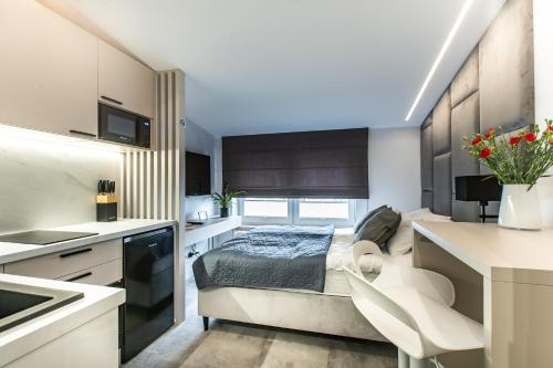 Ένα ή περισσότερα κρεβάτια σε δωμάτιο στο K20 Apartamenty Łódź - Dostęp na Kod