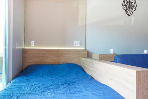 Una cama o camas en una habitación de Sierra Apartments- Estudios Oaxtepec