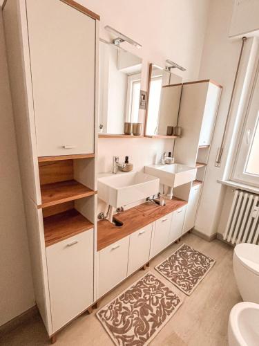 a bathroom with two sinks and a mirror at 583slm in Aosta