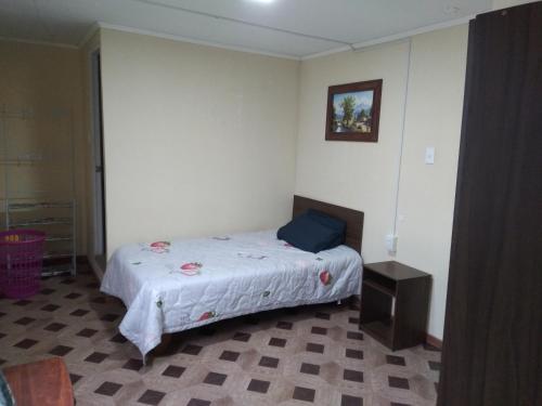 Katil atau katil-katil dalam bilik di Hostal MIRAMAR En Pleno Centro de Pozo Almonte