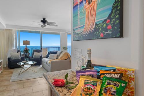 a living room with a couch and a table with snacks at Sapphire Oasis- Heavenly Ocean View and Resort in Kahana