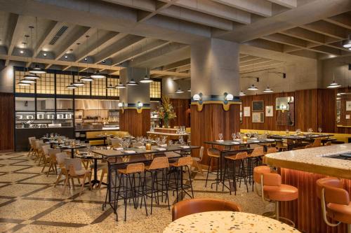 a restaurant with tables and chairs in a room at W Philadelphia in Philadelphia