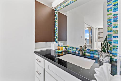 A kitchen or kitchenette at Cozy Ocean View Escape, 1 Block to Beach with Free Parking