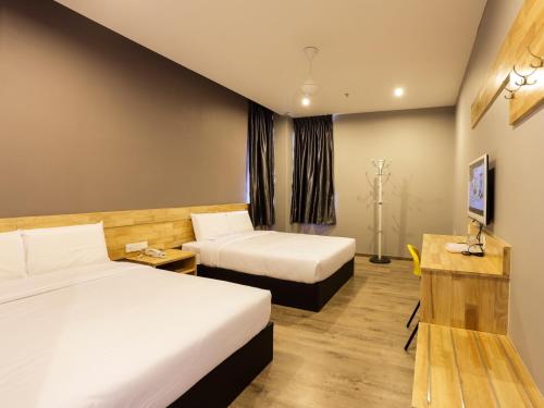 Postel nebo postele na pokoji v ubytování JQ Suria 18 Hotel