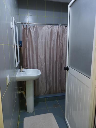a bathroom with a sink and a shower at HOTEL BADINCA Alojamento Low Cost in Bissau avenida FRANCISCO MENDES in Bissau