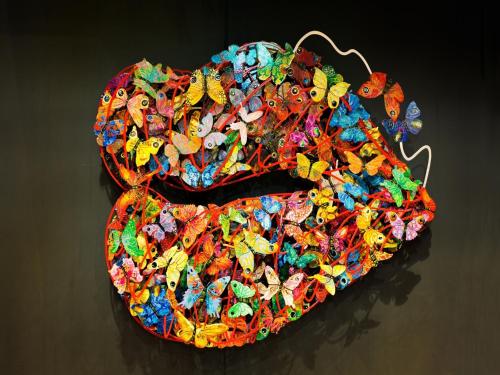 a pile of colorful butterflies on a table at SR Hotel Magok in Seoul