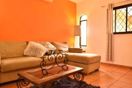 a living room with a couch and a coffee table at Casa Palma in La Paz
