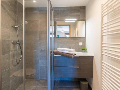 a bathroom with a shower with a sink and a toilet at Appartement Valmorel, 3 pièces, 6 personnes - FR-1-291-890 in Valmorel